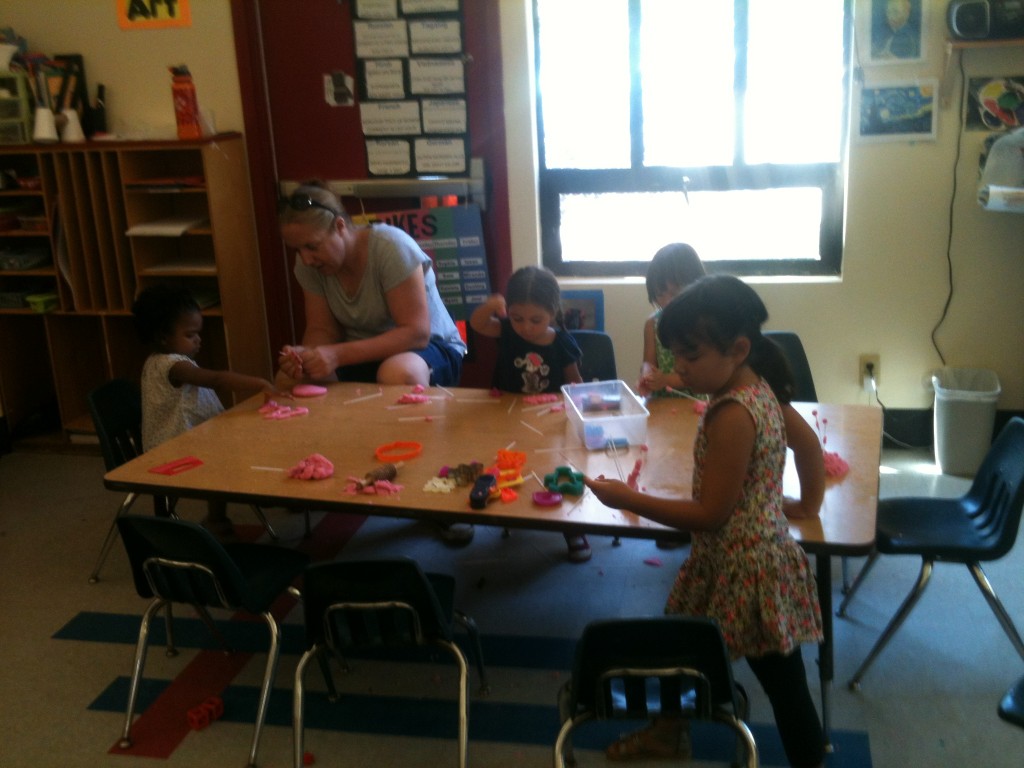 Preschool girls playing with goop